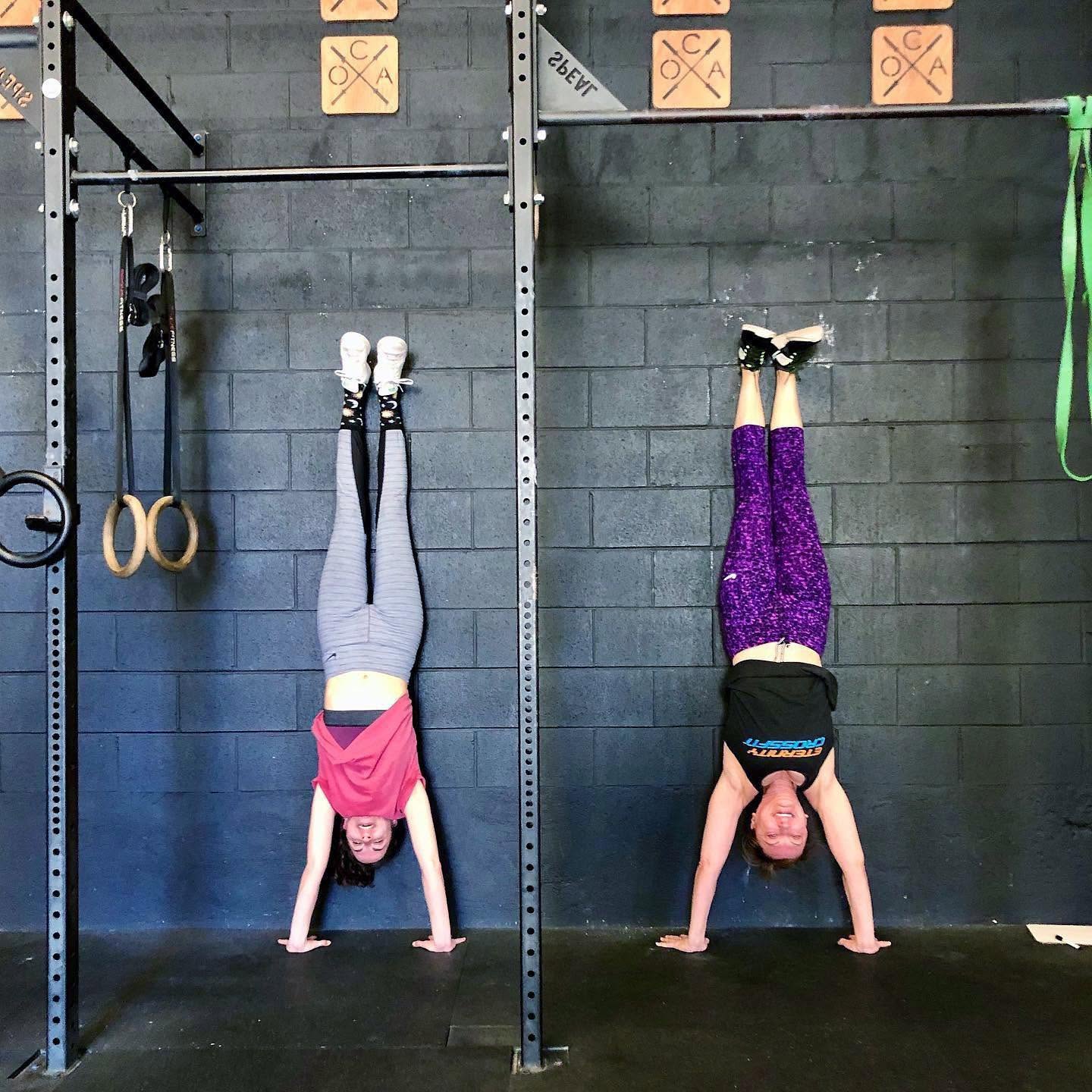 Members scaling a skill at O-SEA CrossFit